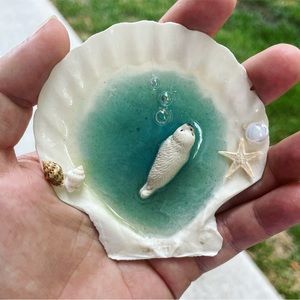 Handmade resin seashell with harp seal - can be made into magnet or ornament